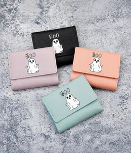Close-up of trifold faux leather wallets with cute ghost prints in four pastel colors