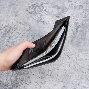 Classic black leather bifold wallet for men featuring dual bill compartments for organization