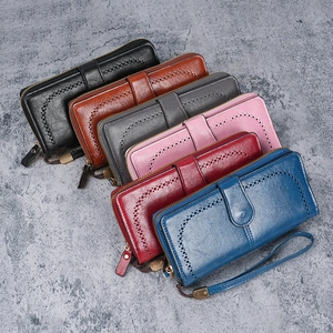 Fashionable long PU leather wallets for women in multiple colors with wave cutout patterns