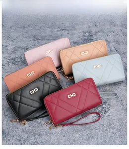 Detailed display of long zippered wallets in six colors with quilted texture and wrist straps