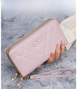 Pink quilted leather women long wallet with double zipper closure and wristlet strap