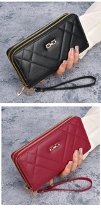 Detail of dual zipper large capacity quilted clutch wallets with wrist strap and gold buckle