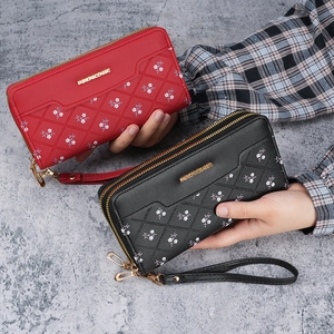 Chic women's long patchwork wallet with quilted floral design and dual zipper detail