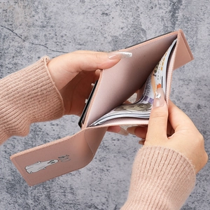 Pink trifold leather wallet for women with ghost pattern and spacious bill compartment