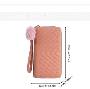 Pink long wallet with V-pattern stitching and plush ball charm, dimensions 19.6cm x 10.7cm