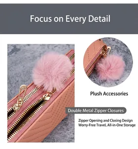 Detail of pink long wallet with V-stitch pattern, double gold zippers and pompom