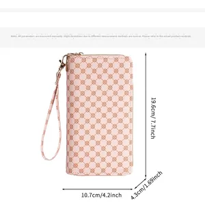 Pink printed women's clutch bag showing dimensions 19.6cm x 10.7cm x 4.3cm with wristlet strap