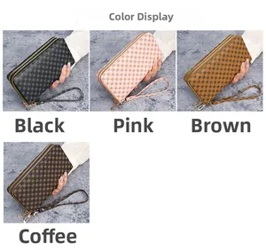 Detail of four colorful PU leather wallets with double zippers and wristlet straps