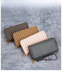 Detailed view of four colorful PU leather wallets with circular patterns and wrist straps