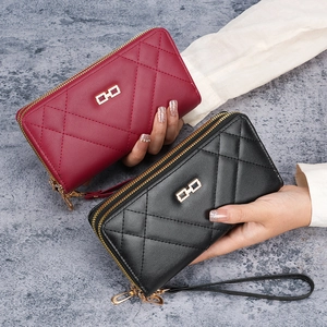 Women's long quilted dual zipper wallet with wristlet, shown in red and black
