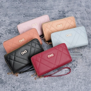 Minimalist quilted women's long wallets with gold geometric logo and wristlet straps