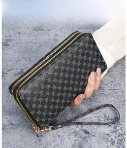 Close-up of black PU leather wallet featuring double zipper and geometric vintage pattern