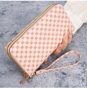 Pink PU leather clutch with brown floral print, double zippers and wrist strap