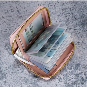 Detail view of pink lychee texture card holder with multiple PVC slots and gold zipper