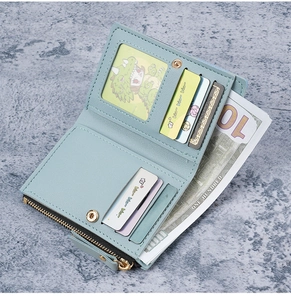 Detail view of mint blue bifold wallet interior showing card slots and coin pocket