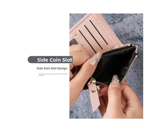 Close-up of pink compact wallet showing side zipper coin pocket and metal snap closure