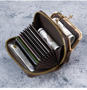 Detailed view of checkered wallet with accordion card slots and vintage metal coin clasp