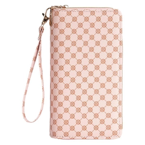 Pink faux leather long wallet with clover pattern and wristlet strap in a studio shot