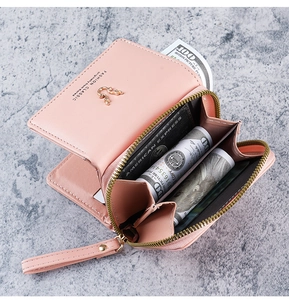 Detail view of pink PU leather wallet showing interior card slots and zipper pocket