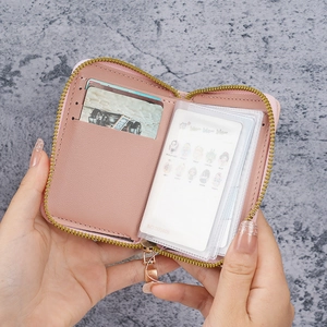 Pink faux leather zipper wallet with multiple transparent card slots for organization