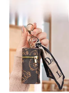 Mini leather coin purse with bear pattern and decorative silk scarf keychain hanging