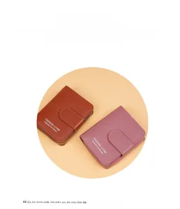Short PU leather wallets in brown and purple with zipper closure and snap buckle