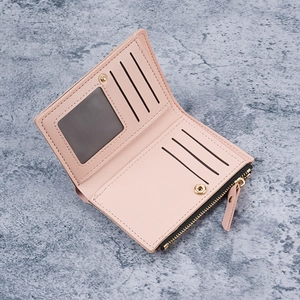 Pink faux leather bifold wallet for women with card slots and a metal zipper coin pocket