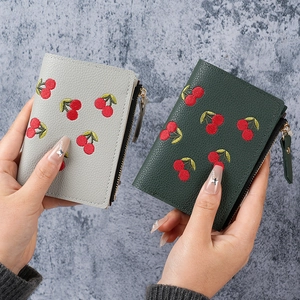 Short cherry embroidered wallets in grey and green leather with gold zipper closure