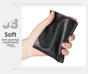 Detail showing the flexible black leather wallet with a soft and comfortable touch