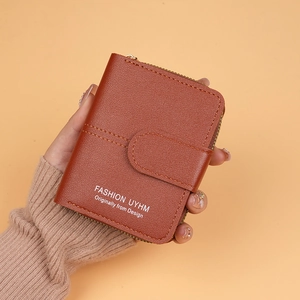 Handheld dark caramel brown faux leather short wallet with zipper and snap closure