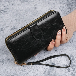 Portefeuille long rétro en cuir ciré noir avec fermeture éclair et dragonne au poignet