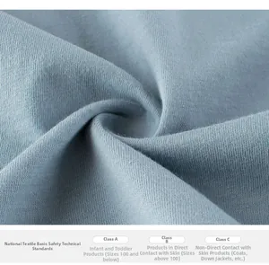 Macro shot of high-quality grey-blue knitted cotton fabric with a fine smooth texture