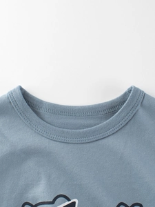 Kids round neck dinosaur print t-shirt in dusty blue cotton with reinforced collar