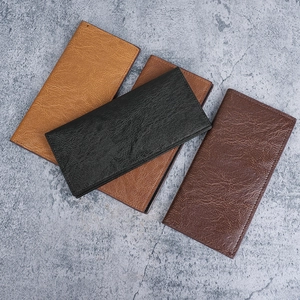 Long slim leather wallet for men in black, dark brown, and yellow with lychee texture