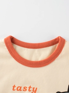 T-shirt enfant en coton crème avec col orange contrasté et imprimé graphique