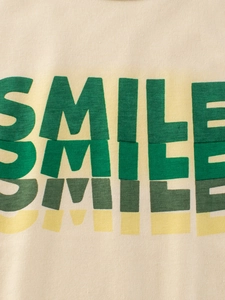 T-shirt beige pour enfants en coton avec imprimé SMILE multicolore et texture