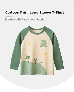 Detailed view of kids cotton t-shirt featuring green dinosaur print and raglan sleeves