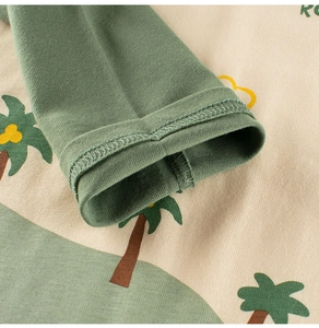 Detail of ribbed cuffs and palm tree print on long-sleeved cotton T-shirt for boys