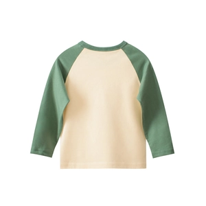 Detail of children raglan sleeve tee showing beige cotton fabric and green neckline stitching