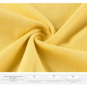 Macro shot of soft yellow knitted cotton fabric texture for baby long sleeve t-shirt