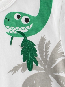 Toddler white cotton T-shirt featuring a green cartoon dinosaur and palm leaf prints