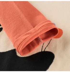 Detail of double-needle sleeve cuff stitching on kids cotton long-sleeve tee shirt