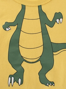 Front view of yellow cotton kids T-shirt with green cartoon dinosaur print