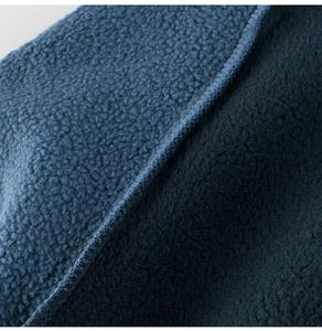 Detail of dark blue double-sided fleece fabric showing polar and fine velvet textures