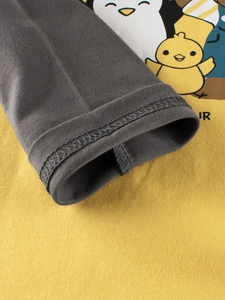 Kids long sleeve yellow tee with charcoal sleeves and cute penguin cartoon print