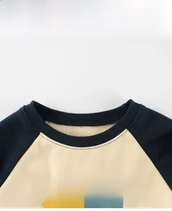 Detail display of kids fleece sweatshirt neckline and sunlight printed artwork