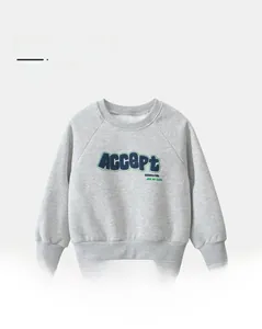Detail of grey fleece-lined sweatshirt showing the high-quality Accept letter print