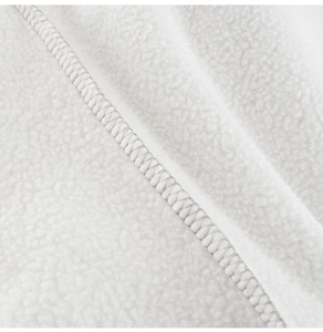 Close-up detail of soft white polar fleece fabric with precise parallel stitching lines