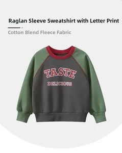 Detail of kids fleece raglan sweatshirt with cotton blend fabric and letter print