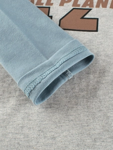 Boys long sleeve shirt with grey body blue cuffs and ALL PLANET print detail